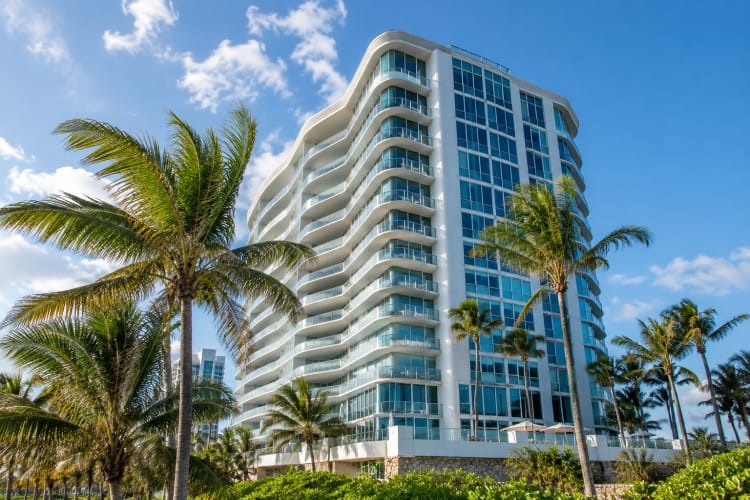 Modern coastal condominium tower representing high-value Florida condo association reserve accounts